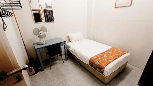 Bandar Melaka House | Single Bed Fan Room with Shared Bathroom
