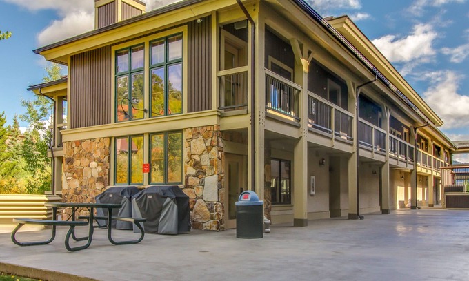 Four O'Clock Apartment | Ski-in/out studio condo with heated underground parking, hot tub & grill