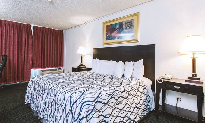Wichita House | Sky-Palace Inn & Suites Wichita East - 1 King Bed Suite Smoking Oversized