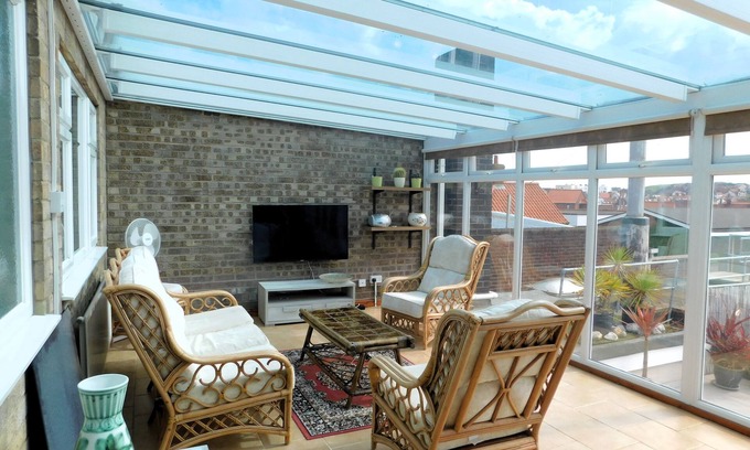 Sheringham Apartment | Sky View - Enjoy panoramic roof top views from the sunny conservatory or outside deck.
