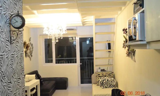 Tagaytay Apartment | SMDC Wind Residences 102 Loft Bedroom Facing Amenities with WIFI and Parking