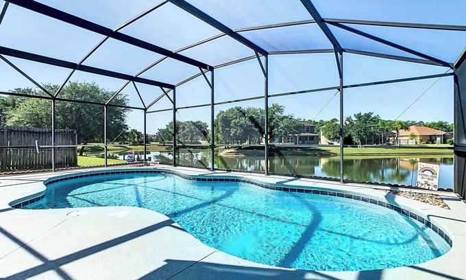 Crescent Lakes House | Smiling Disney Oasis heated pool home in Kissimmee with Game room.