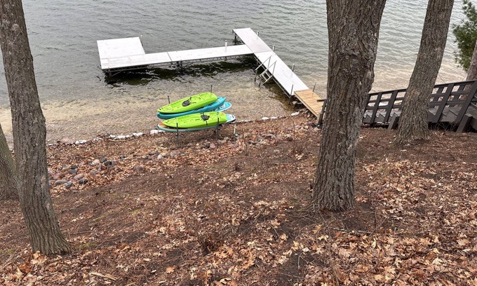Wautoma House | Soak Up the Last Rays- Hot Tub Pier & Paddleboards