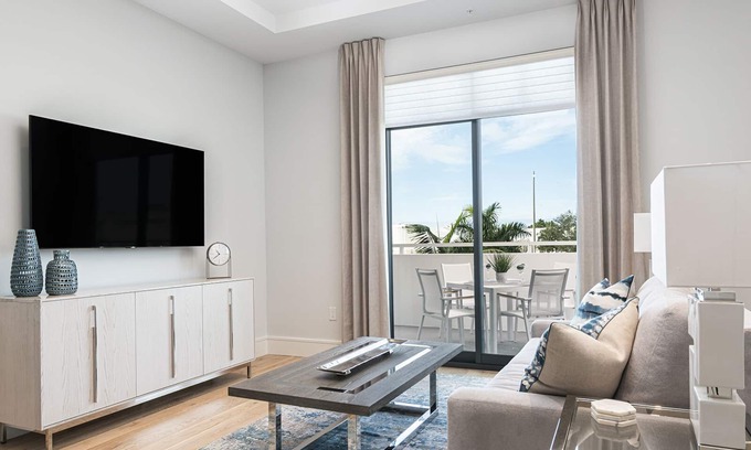 Old Naples Condo | SOCE FLATS 202 - Luxury Two Bedroom with Wraparound Balcony!