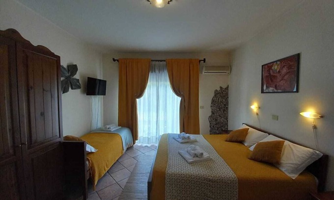 Villagonia Apartment | Sole Mare Giardini Naxos 'Family Room with View' with Balcony, Wi-Fi and Air Conditioning