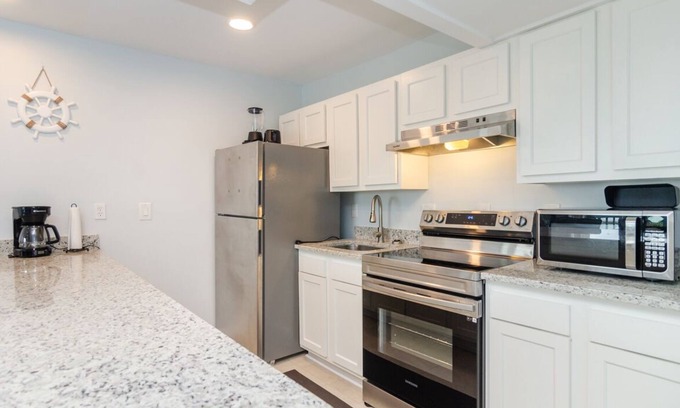 North Carolina Coast Condo | Sound front condo w dock access and rooftop deck!