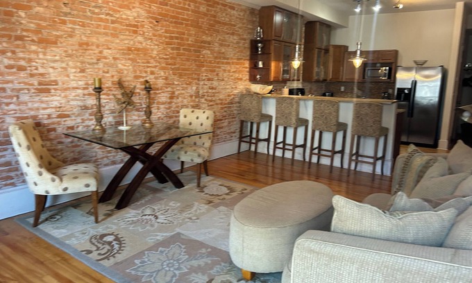 Wabasha Condo | Spacious 1 bed/1 bath historical loft offers exposed brick, and high ceilings.