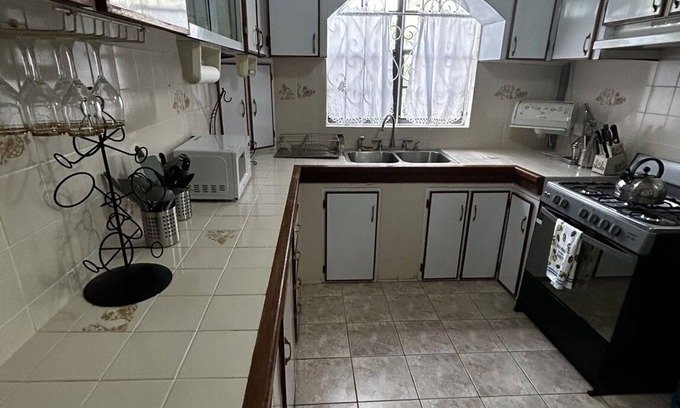 Massacre House | Spacious 4-bedroom residence featuring a ground floor apartment.