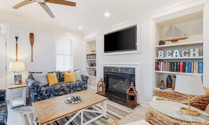 Sunset Island House | Spacious beachside home with fireplace, washer/dryer, pools, dock, & gym