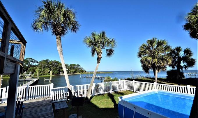 St. George Island House | Spacious house- Deep Water Dock, Pool, Game Room, Hot Tub, Fenced Yard & more!