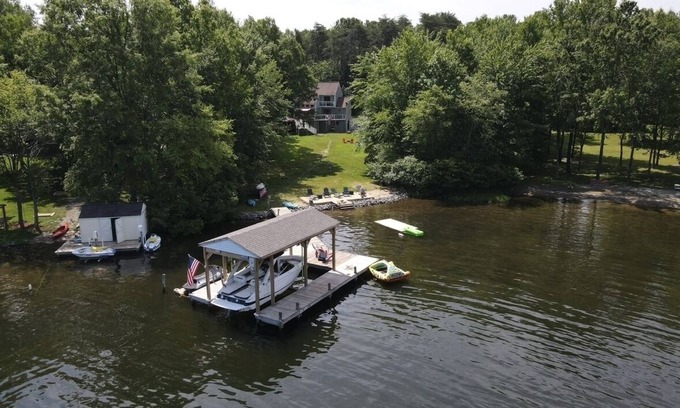 Bumpass House | Spacious lakeside home featuring a private cove, hot tub, dock & theater room