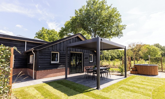Municipality of Ede House | Spacious wellness home for 6 guests with a private sauna and hot tub in the garden. Stylish, single-floor layout and designed for pure relaxation.