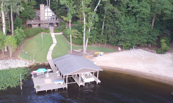 Henrico House | Spectacular main lake views with sandy beach and sunset