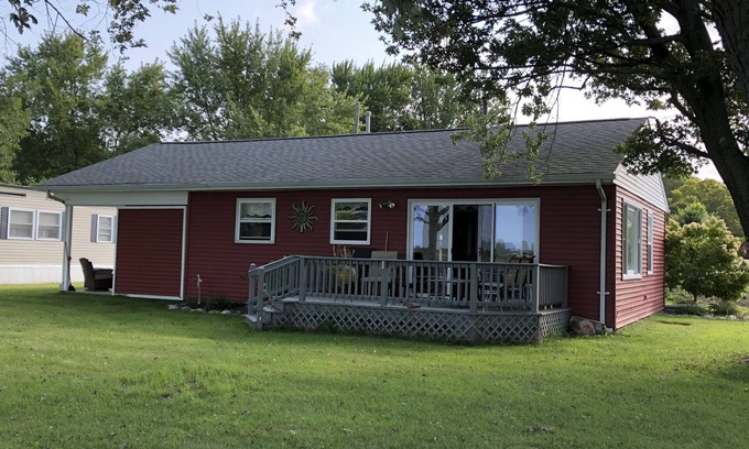 Coldwater Cottage | Spectacular sunset views and north chain lake front red cottage rental