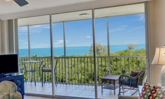 Vanderbilt Beach Condo | Spectacular unobstructed GULF, BAY and SUNSET view, 5 minutes walk to the beach.