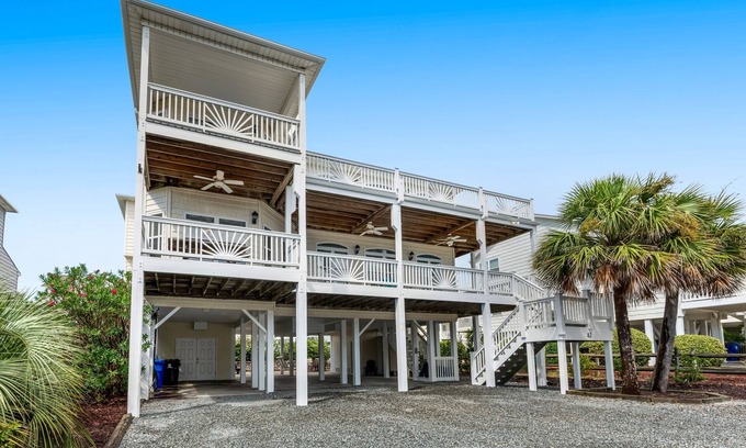 Ocean Isle Beach House | Sprawling home with pool access, balconies, enclosed yard, & grill - dogs ok