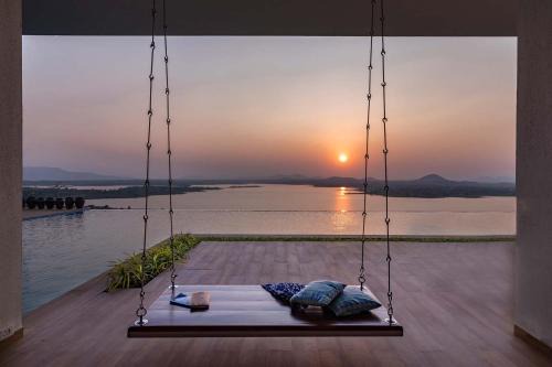 Igatpuri Villa | StayVista at Sunset on the Lake - Infinity Lakeview Swimming Pool with Contemporary Interiors & Lavish Amenities