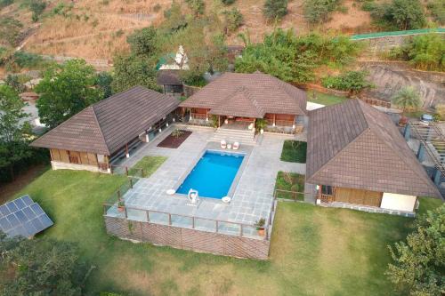Lonavala Villa | StayVista's Vyoman Villa - Experience a valley view, lush lawn, spa, and yoga retreat