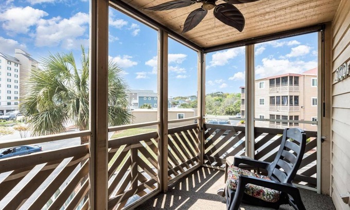 Ocean Drive Condo | Steps to the beach, outdoor pool, and 10 minute walk to Main St. attractions.