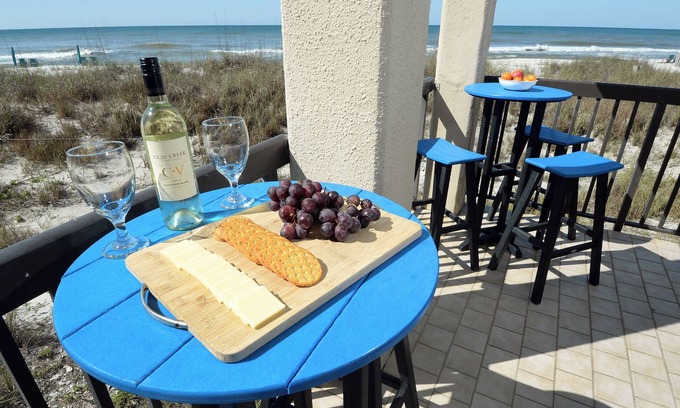 Sunnyside Condo | Steps to the beach with wrap-around ocean-front balcony