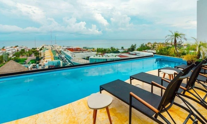 12th Street Apartment | Studio with AC Kitchen Pool Gym and Rooftop view