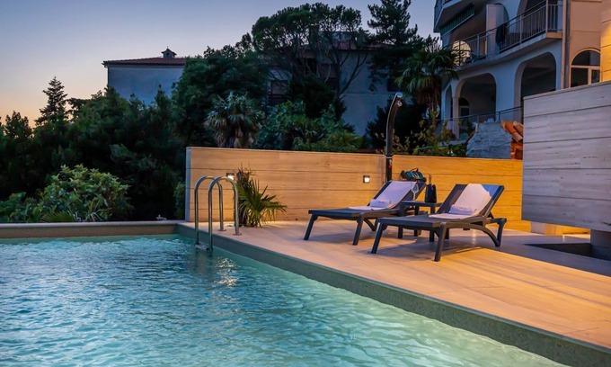 Selce Apartment | Stunning flat right by the sea with pool, sea view, outdoor shower, sunbeds