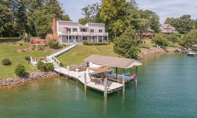 Huddleston House | Stunning Lake Home with Private Dock, Spa, Fire Pit
