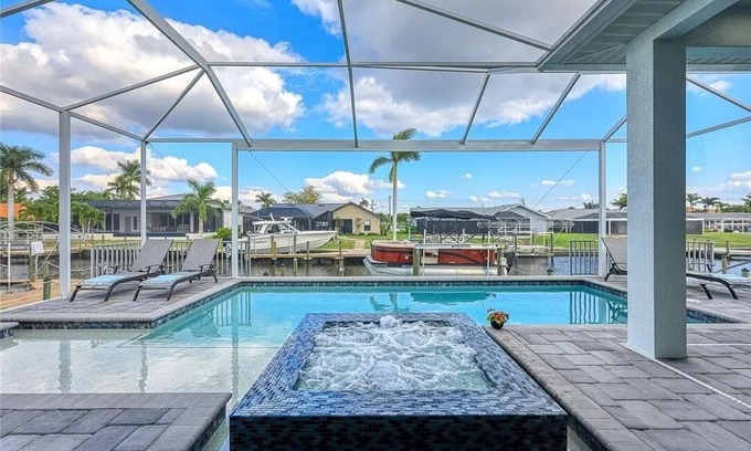 Pelican Villa | Stunning New Waterfront Luxury Villa with oversized Heated pool and Hot tub!
