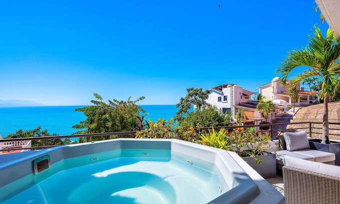 Conchas Chinas Apartment | Stunning ocean view apartment with hot tub, balcony, & AC- near beaches