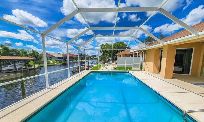 Palm Harbor House | Stunning Pool Home~Boat Dock~Game Room~King Beds