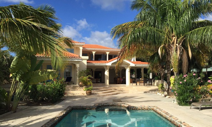 Falmouth Harbour Villa | Stunning six bedroom seafront villa with pool, garden and sea views