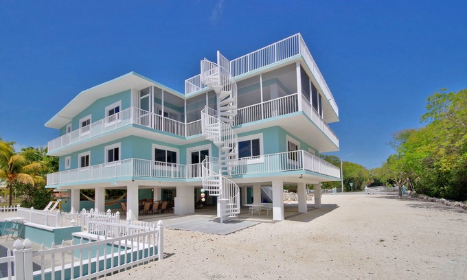 Anglers Park House | Stunning Three Level House on Key Largo Canal with a heated pool and roof deck.