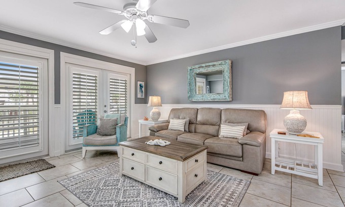 Holiday Isle Condo | Stylish waterfront condo with pools, hot tubs, private beach, & sports courts