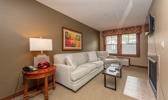 Thayerville Apartment | Suites at Silver Tree A116: 1 bedroom standard view suite with fireplace, kitche