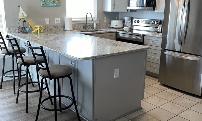 North Carolina Coast Condo | Sun Skipper Ocean Front Top Floor Pink Coral Buidling