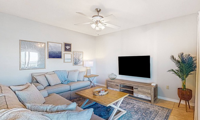 Pensacola Beach Condo | Sunlit & tropical beachfront condo with pool, gym, balcony views