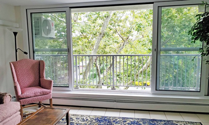 Queens Apartment | Sunny 1-bedroom apartment in Bayside, close to restaurants, shops, and train.