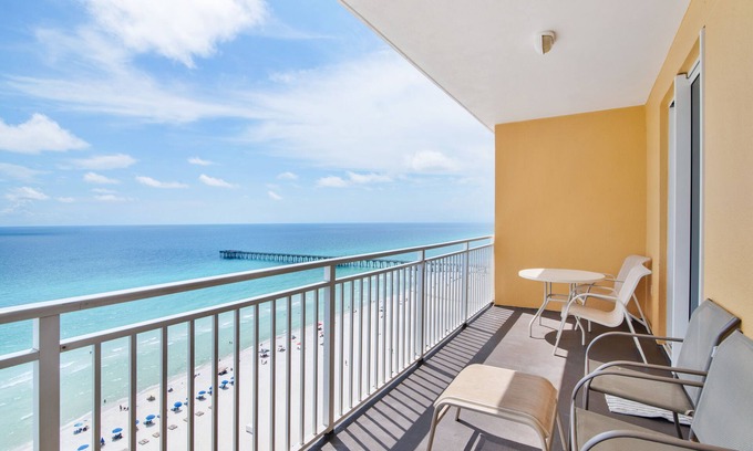 Panama City Beach Condo | Sunny getaway at the beach with furnished balcony, pool & fitness room