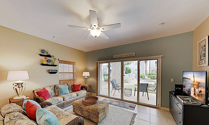 Butler Beach Condo | Sunny Poolside Condo w/ Patio: Hot Tub & Beach Access, Near Shopping & Dining
