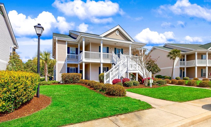 Sunset Beach Condo | Sunset Village top-floor end unit with golf & pond views, pools & hot tub