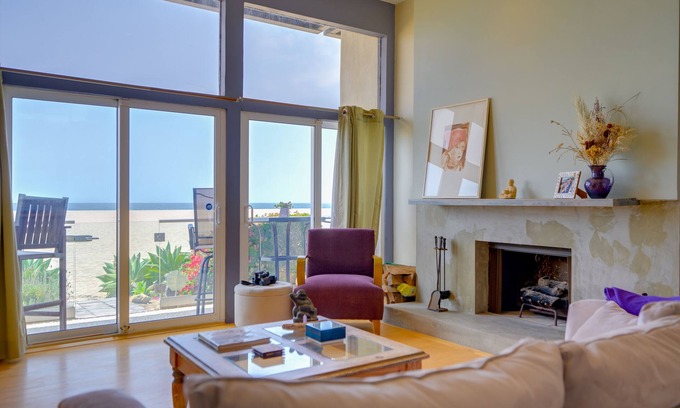 Marina Peninsula Condo | Sunsets and sweeping views, sliding doors open to the sand