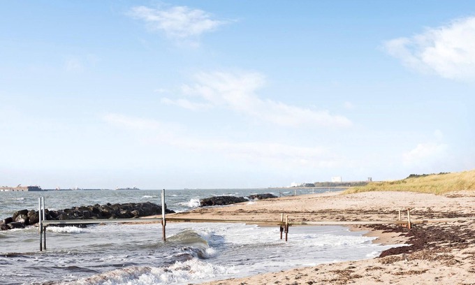 Rodby House | Take advantage of the proximity to the sandy beach in this practical vacation home.