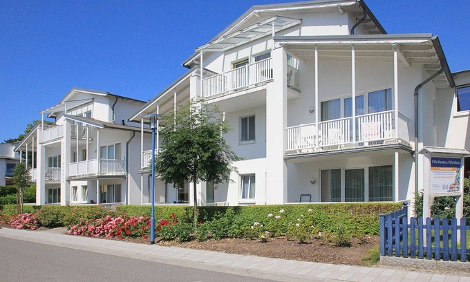 Gohren Apartment | Terrace, free use of the AHOI adventure pool and sauna - Villa Karola FeWo 02