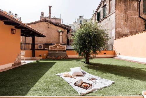 Monti Apartment | The Best Rent - Peaceful oasis with garden near the Colosseum
