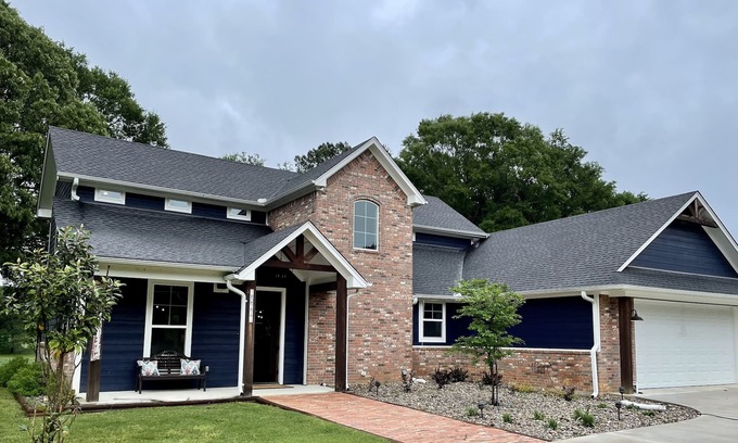 Tyler House | The Blue House on Two Lakes