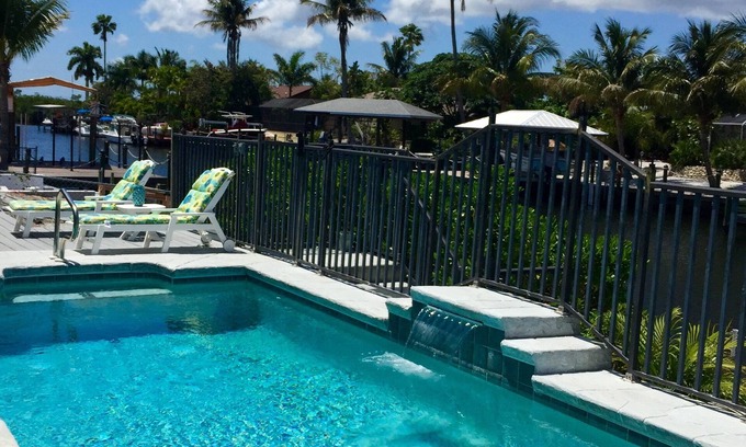 Matlacha Isles House | The Blue Lagoon With Heated Pool/on the Canal With NEW Boat Lift and Dock