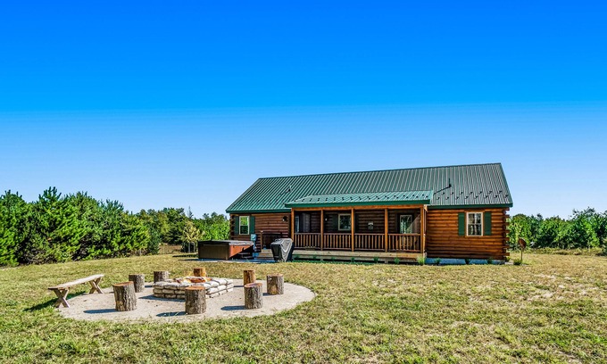 Thompsonville Cabin | The Cozy Cabin with a private hot tub, screened porch, W/D & AC - dog-friendly