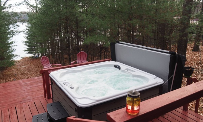 Kalkaska Ski Chalet | The Cub Hill Chalet on Cub Lake - Private Lakefront, Dock, Raft, Water Toys, Huge Deck, and Spa!