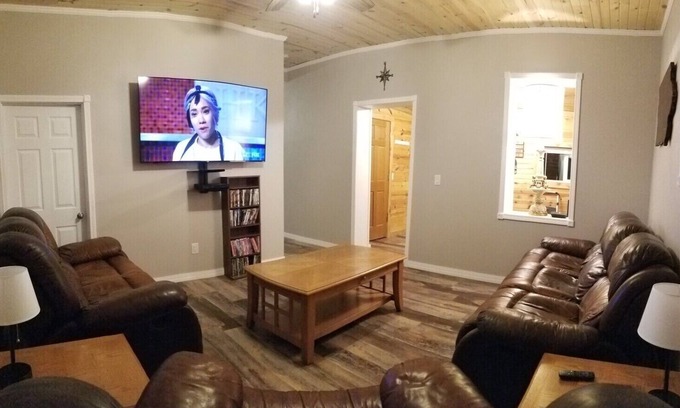 Guttenberg House | “The Depot” 2bedroom “3beds” 1 bath home. Outdoor party area with tv