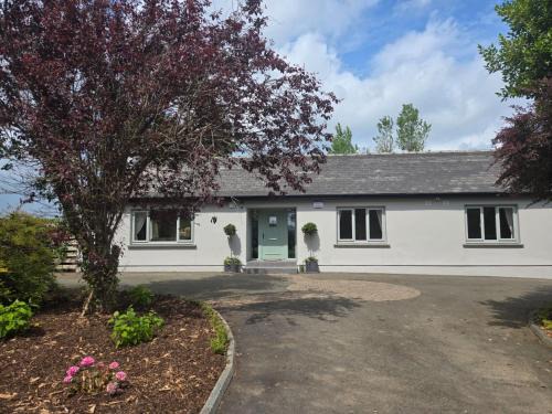 Camolin House | The Lazy Acre - Secluded Cottage with Garden & Sunset Views